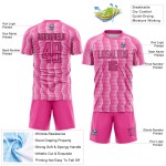 Benutzerdefiniertes rosa schwarz-weißes geometrisches Sublimations-Fußballuniformtrikot Benutzerdefiniertes rosa schwarz-weißes geometrisches Sublimations-Fußballuniformtrikot